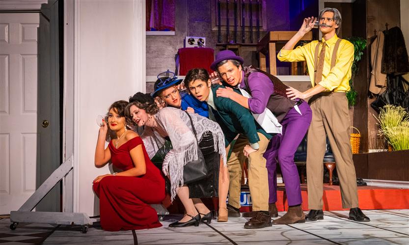 Students perform Clue onstage